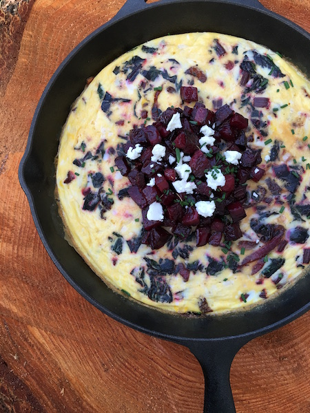 This Beet Greens and Goat Cheese Frittata is delicious by itself or topped with roasted beets as pictured here.